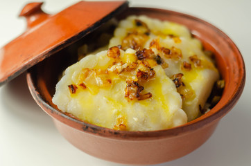 Close up of dumplings sprinkled with fried onion, traditional Polish, Russian and Ukrainian cuisine