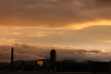 Obraz premium Mariahilf parish church (originally Pfarrkirche Mariahilf or Heldendankkirche) tower at sunset in Bregenz, Vorarlberg, Austria.