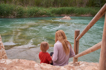 Mother and son watching the mighty river,
