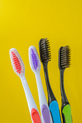 toothbrushes are multicolored on a bright colored background close-up