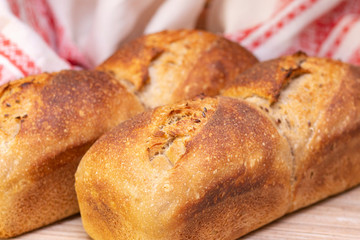 Bakery - golden rustic bread crusts. Fresh aromatic bread on the table. Food concept.