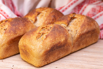 Bakery - golden rustic bread crusts. Fresh aromatic bread on the table. Food concept.