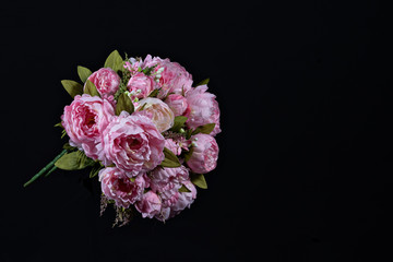 Beautiful bouquet of pink peonies . Floral composition on black background.