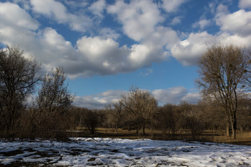 Winter landscape with little snow on a sunny day