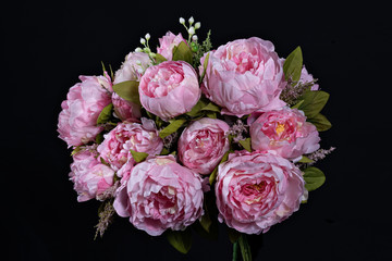 Beautiful bouquet of pink peonies . Floral composition on black background.