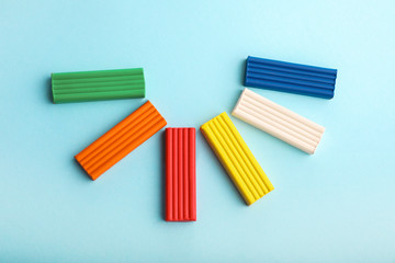Multi-colored plasticine on blue background