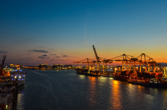 Elevated view onto the Port of Hamburg (Hamburg Hafen), Germany at sunset. The Port of Hamburg is Germanys biggest port, located at the Elbe river.