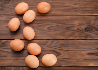 Fresh eggs on  wooden background