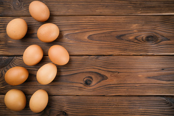 Fresh eggs on  wooden background