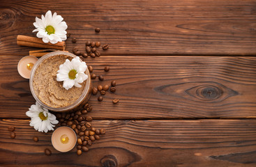 Coffee scrub on brown wooden background