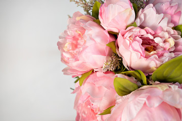 bouquet of pink peonies on white background copy space.