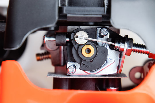 Elements of the fuel system of a gasoline trimmer. Fuel tank and carburetor trimmer engine. Fuel system of a carburetor two-stroke engine.