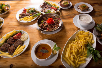 assorted turkish kebabs on wooden table