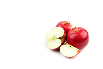red apples and half of apple isolated on white background
