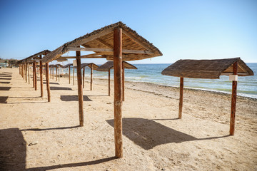 Straw canopies on the sea shore