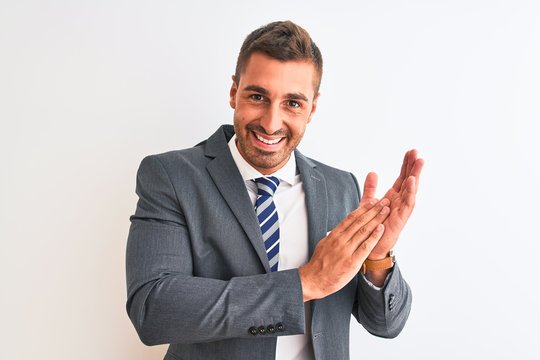 Young Handsome Business Man Wearing Suit And Tie Over Isolated Background Clapping And Applauding Happy And Joyful, Smiling Proud Hands Together