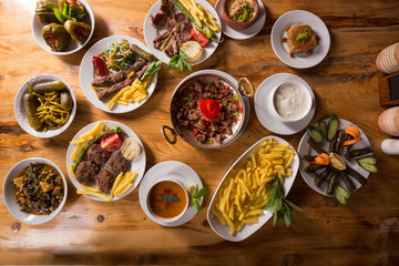 assorted turkish kebabs on wooden table