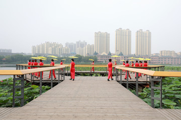 Naklejka premium Chinese Cheongsam Walking Show in the Park, Luannan County, Hebei Province, China