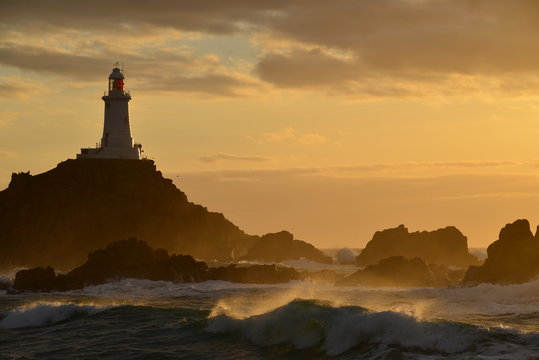 Corbiere lighthouse, Jersey, U.K. Telephoto image of a coastal structure with Spring tides.