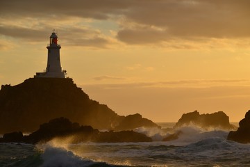 Corbiere lighthouse, Jersey, U.K. Beacon at sunset in Spring.