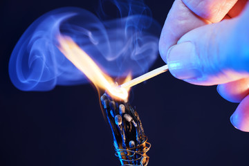 Lit matches and blown out in the studio photographed with colorful foils before the flashes