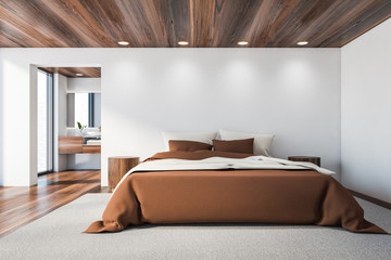 White master bedroom and bathroom, brown bed