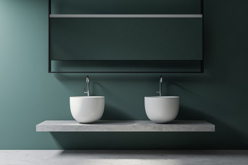 Double sink in green bathroom interior
