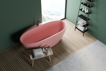 Green bathroom with pink tub and shelves, top view