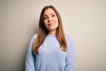 Fototapeta premium Beautiful young woman wearing casual winter sweater standing over isolated background Relaxed with serious expression on face. Simple and natural looking at the camera.
