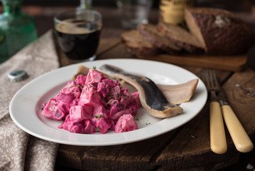 Homemade Beet and Potato Salad Served with Salted Herring Fillet