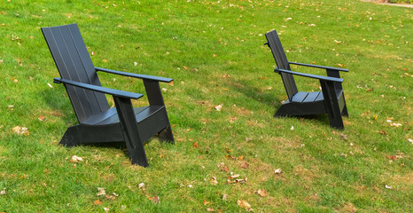 Obraz na płótnie Canvas PRINCETON, NJ USA - NOVENBER 12, 2019: Landscaping, iron chairs on the green grass at Princeton University. New Jersey USA