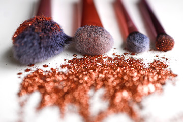Cosmetic brushes in glitter
