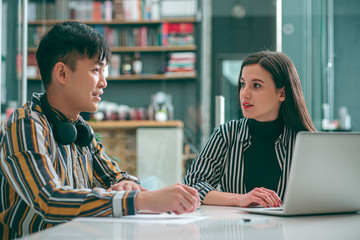 Interested woman listening to colleague stock photo
