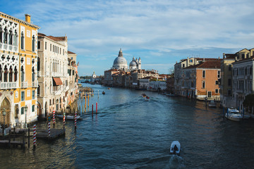 View of Canal Grande, boats and ships on the water with passengers.