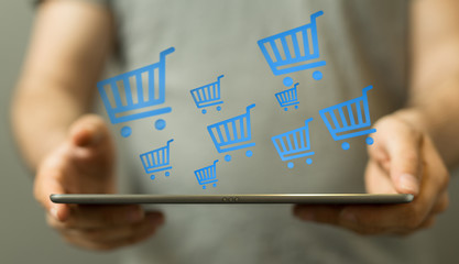 Shopping cart on digital tablet. Shopping online concept..