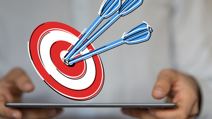 arrow hitting in the target center of dartboard on bullseye.