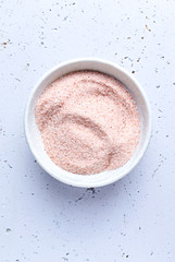 Pink Himalayan Salt in a ceramic bowl. Top view