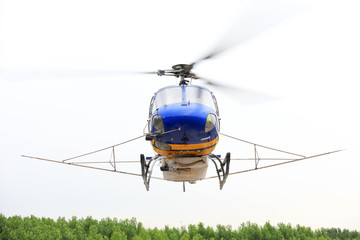 Agricultural helicopters fly in the sky