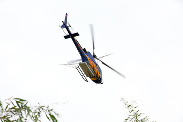 Agricultural helicopters fly in the sky