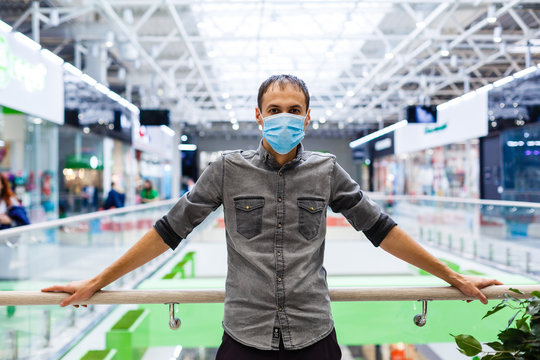 Man wearing mask for protect Novel Coronavirus:2019 or PM 2.5 dust and serious of the air pollution in department store. - Powered by Adobe