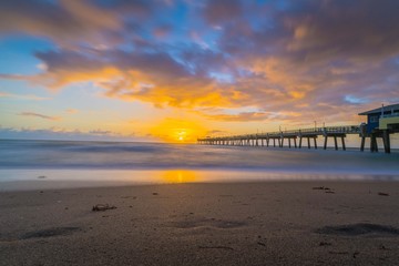 sunset beach water sea sky sunrise bridge nature florida clouds sun summer orange blue beautiful horizon coast calm