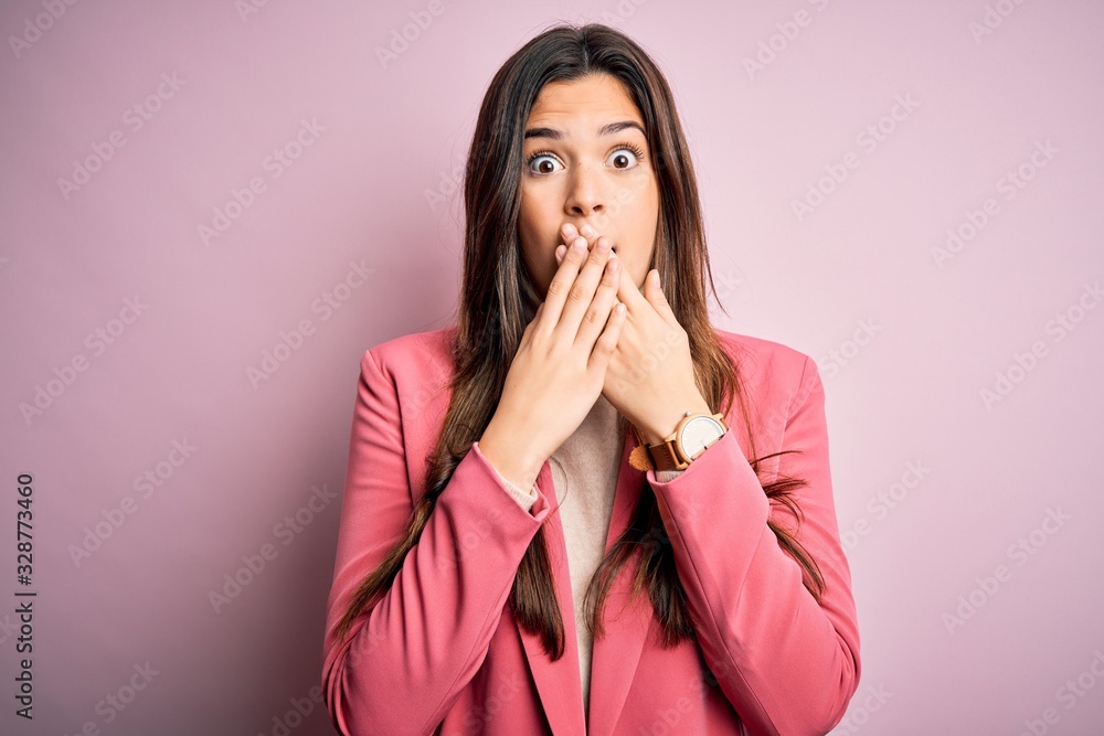 Sticker Young beautiful businesswoman wearing casual turtleneck sweater and jacket shocked covering mouth with hands for mistake. Secret concept.