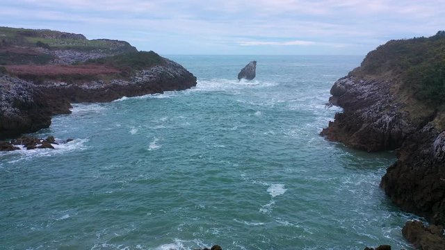 Swell around the Islote El Picon,  aerial view of Buelna beach, Cantabrian Sea, Asturias, Spain, Europe