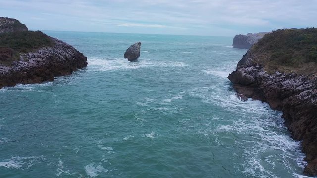 Swell around the Islote El Picon,  aerial view of Buelna beach, Cantabrian Sea, Asturias, Spain, Europe
