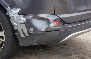 dented rear fender on car