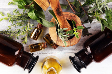 Homegrown and aromatic herbs on rustic background with rosemary and basil