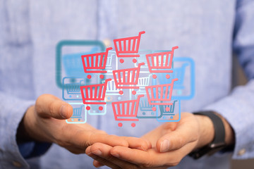 Businessman pressing modern technology panel shopping cart web phone credit card.