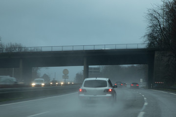 Fototapeta na wymiar Bonn, NRW, Germany, 06 03 2020, cars driving on a highway in rain