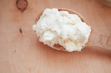 Spoon cottage cheese. Nutrition on a diet. Keto diet. Interval fasting. Farm dairy products. Healthy breakfast.