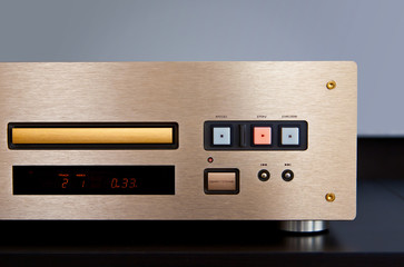 Expensive Stereo CD Player with Golden Front Panel Plays Music on Compact Disk